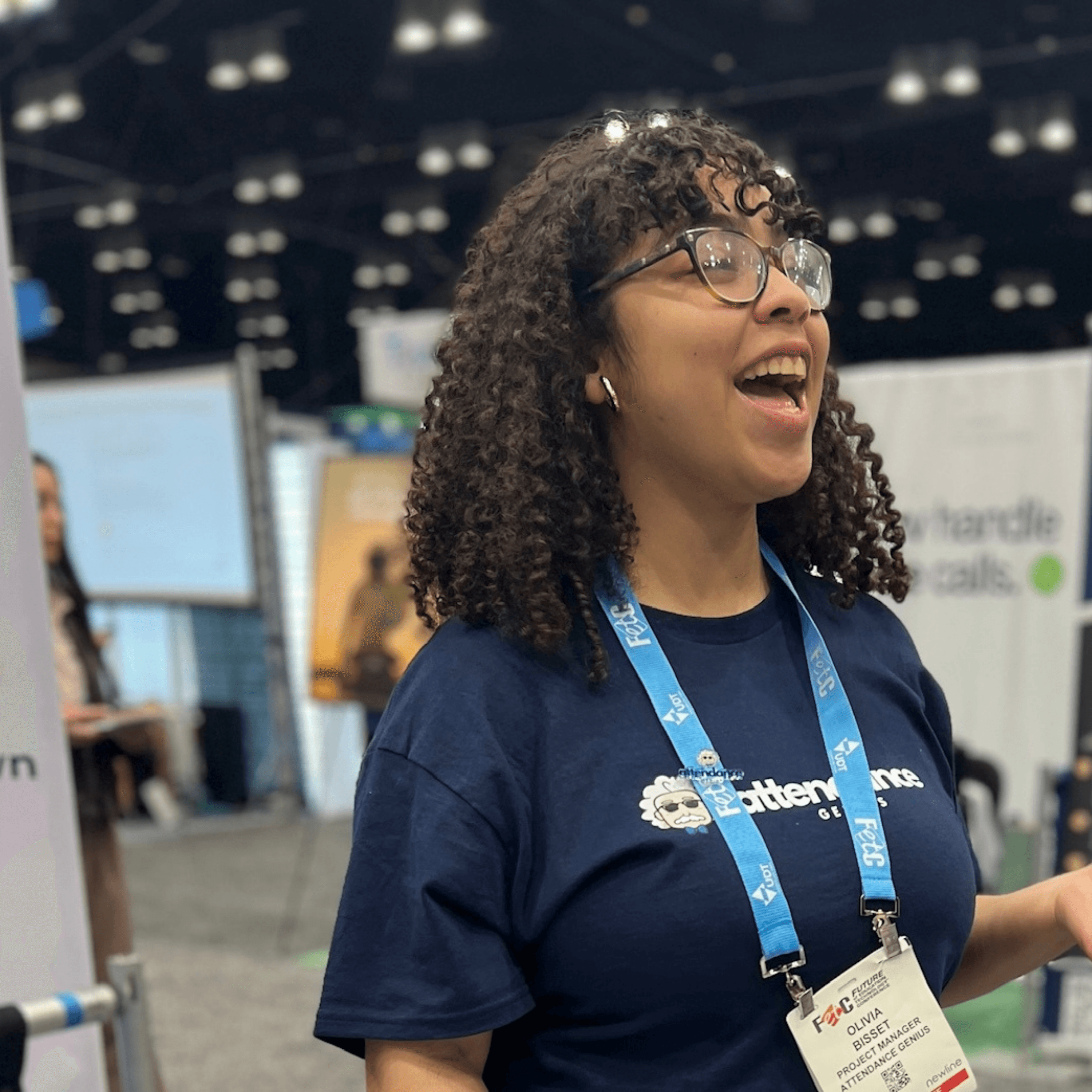 Olivia Bisset smiling at a conference